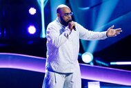 Darius J performing on stage on The Voice Season 27, Episode 1.