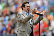 Christopher Macchio sings the national anthem at a baseball game