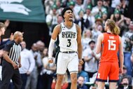 Michigan State Spartans guard Jaden Akins (3) shouts in celebration during a game.