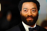 Chiwetel Ejiofor smiles in a tuxedo.