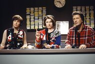 Margaret Jo McCullin (Ana Gasteyer), Pete Schwetty (Alec Baldwin), and Terry Rialto (Molly Shannon) sit in front of mics on Saturday Night Live Episode 2409.