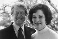 Jimmy and his wife Rosalynn Carter smile together outside