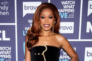 Keke Palmer smiles in a black dress at Watch What Happens Live With Andy Cohen Season 22, Episode 10.