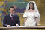 Jimmy Fallon sits next to Rachel Dratch, who wears a wedding dress, on SNL Episode 2604.