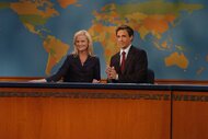 Amy Poehler and Seth Meyers sit in front of the Weekend Update map on SNL Episode 3204.