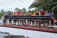 The cast stands with open briefcases on Deal or No Deal Island Episode 203.