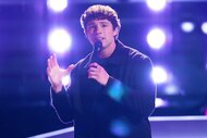 Britton Moore performing on stage on The Voice Season 27, Episode 2.