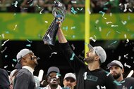 Head coach Nick Sirianni of the Philadelphia Eagles holds up the Vince Lombardi Trophy after Super Bowl LIX.