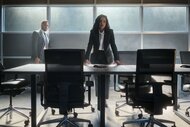 Jacob Hassani (Patrick Sabongui) watches Elizabeth Mallory (Zabryna Guevara) lean on a desk in The Hunting Party Episode 102.