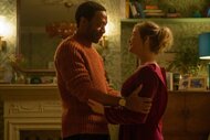 Mr. Walliker (Chiwetel Ejiofor) and Bridget Jones (Renée Zellweger) hold each other in Bridget Jones: Mad About the Boy (2025).