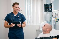 Dr. Bruce in a hospital room with Jonathan on St. Denis Medical Season 1, Episode 12.