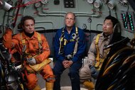 Chris Lemons, Duncan Allcock, Dave Yuasa together in a submarine in Last Breath (2025).