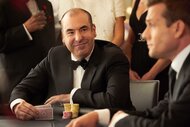 Louis Litt at a table playing cards in Suits Season 8, Episode 12.