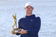 Rory McIlroy of Northern Ireland poses with THE PLAYERS Championship 2025 trophy.