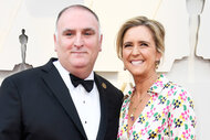 Jose Andres and Patricia Andres smile together on the red carpet at the 91st Annual Academy Awards