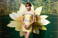 Lisa wears a lotus themed dress on the red carpet at the The White Lotus at Four Seasons Premiere Afterparty