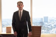 Rick Dodson (Bryan Greenberg) stands in a suit in Suits L.A. Episode 103.