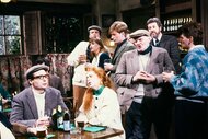 Mike Myers, Kevin Nealon, Jan Hooks, Conan O'brien, and Terry Turner gathered together in a pub during Saturday Night Live Season 15, Episode 15.