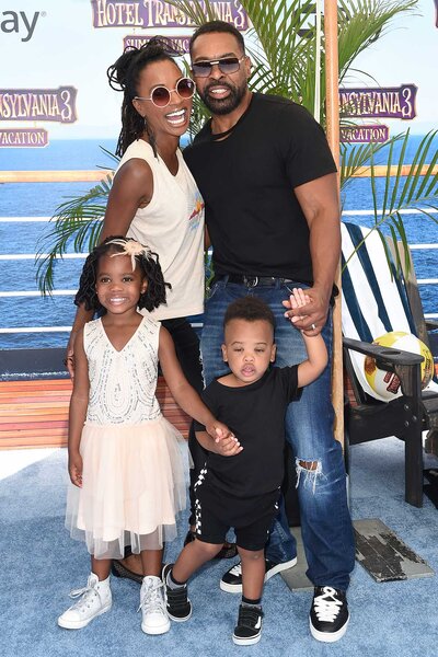 Shanola Hampton and Daren Dukes pose with their family at an event