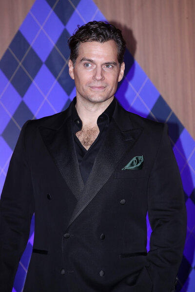 Henry Cavill stuns in a velvet black suit.