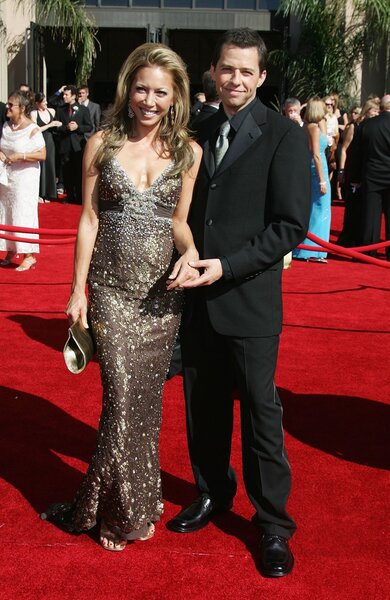 Jon Cryer and Lisa Joyner pose on the red carpet at the 58th Annual Primetime Emmy Awards