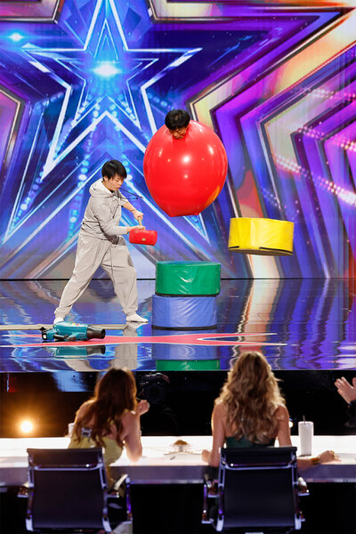 Balloon Taro performs on stage on America's Got Talent Episode 1906