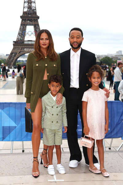 Chrissy Teigen and John Legend attends the 2024 Olympic opening ceremony in paris with their children