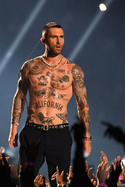 Adam Levine of Maroon 5 performs shirtless during the Pepsi Super Bowl LIII Halftime Show