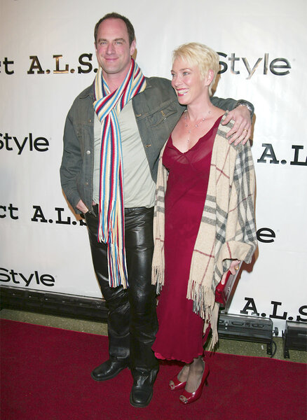 Chris Meloni and Sherman Williams attend a red carpet in leather pants and scarf