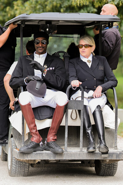 Snoop Dogg and Martha Stewart ride on a golf cart in equestrian outfits at the 2024 olympics