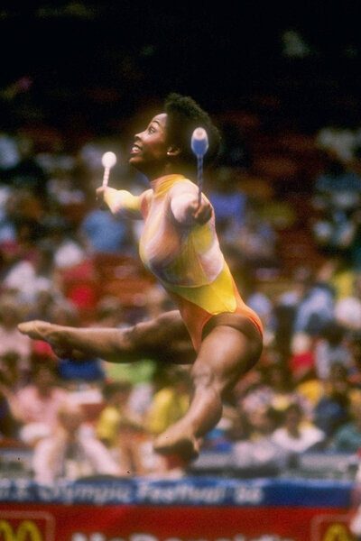 Wendy Hilliard jumps in the air during a routine in 1986