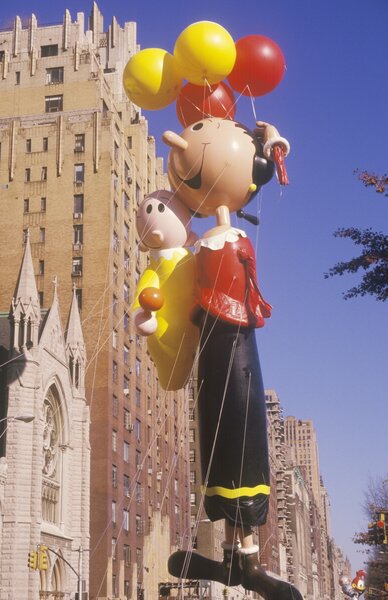 An Olive Oyl Balloon floats in NYC.