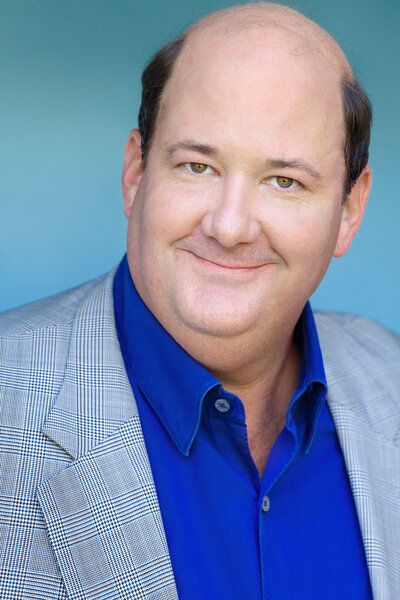 A headshot of Brian Baumgartner