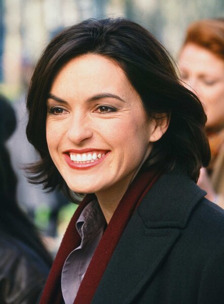 Detective Olivia Benson smiling in Law and Order: Special Victims Unit Season 1, Episode 13.