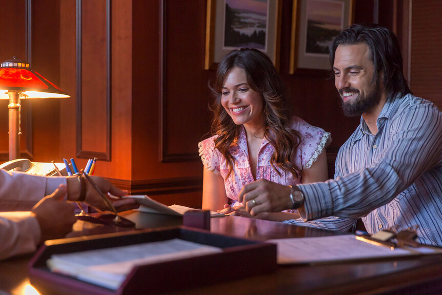 Jack And Rebecca Smiling At A Table