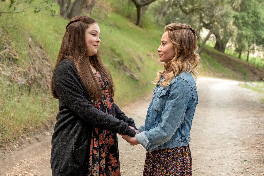 Young Sophie Holding Young Kate's Hands