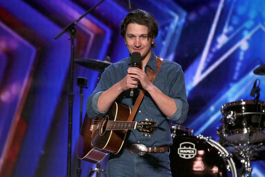 Country Singer Drake Milligan speaking on the America's Got Talent stage