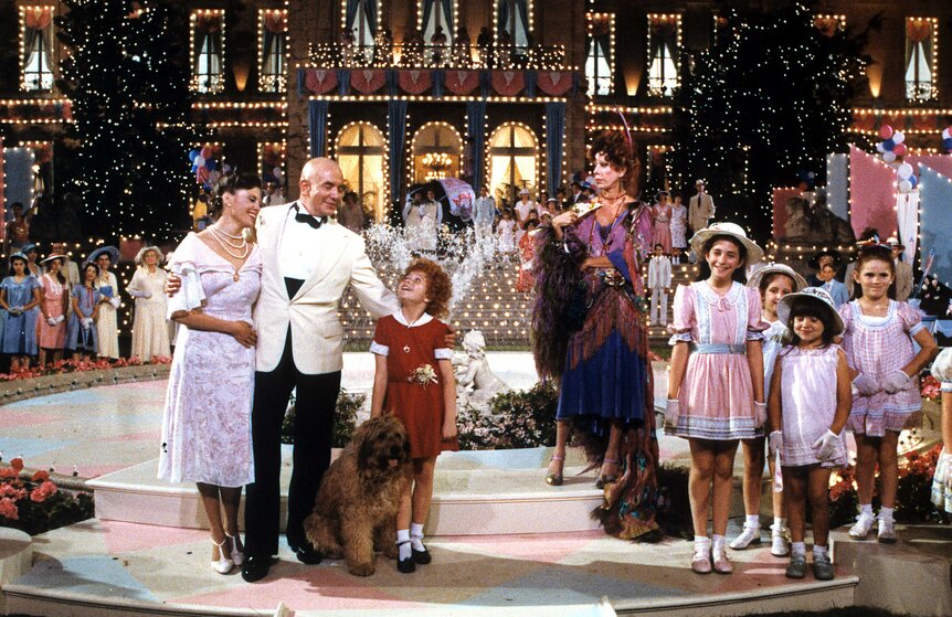 Carol Burnett and the cast of Annie.