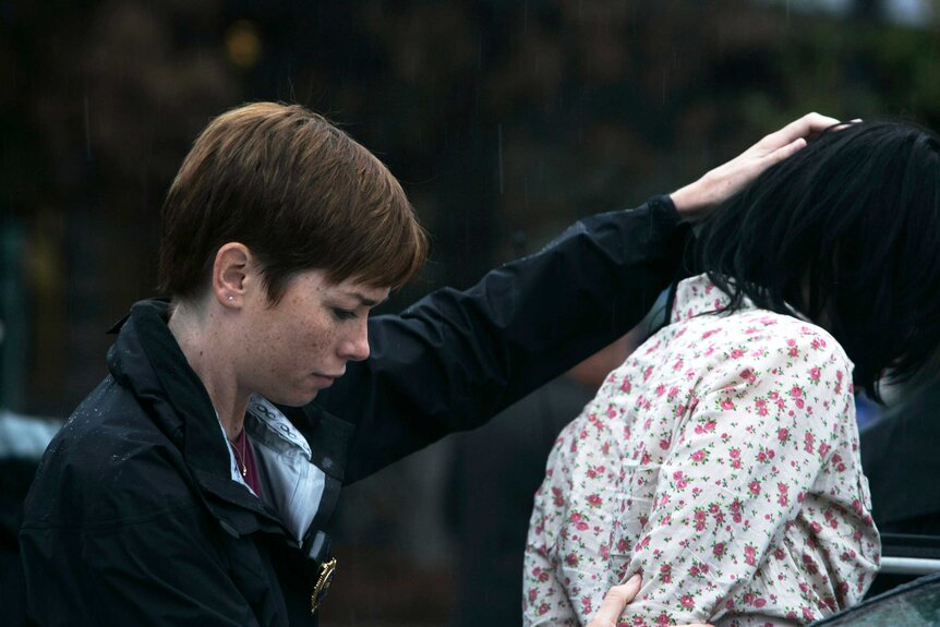 Julianne Nicholson arresting someone on an episode of Law & Order: Criminal Intent.