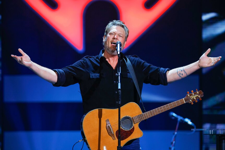 Blake Shelton performing on stage.