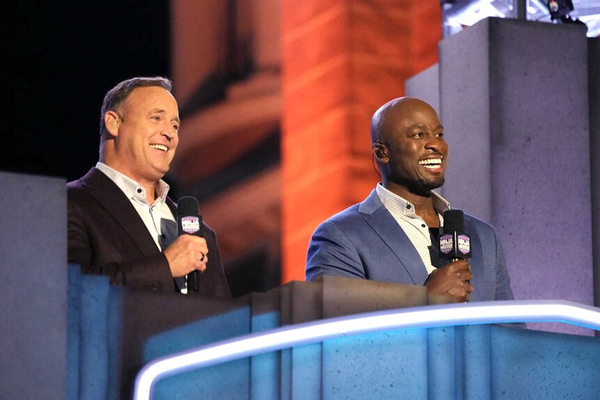 Matt Iseman and Akbar Gbajabiamila hosting American Ninja Warrior.