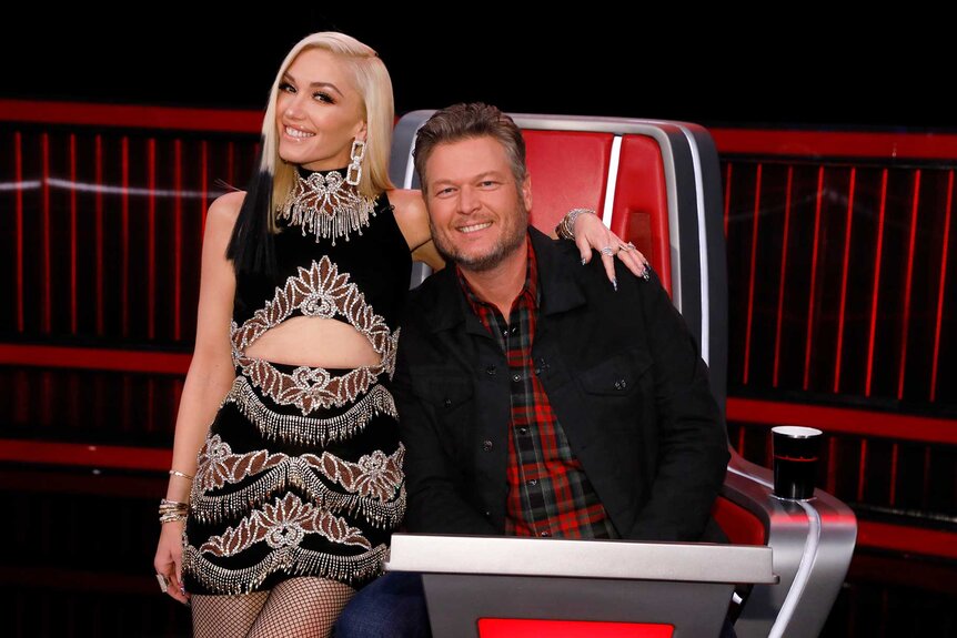 Gwen Stefani and Blake Shelton posing together during The Voice.