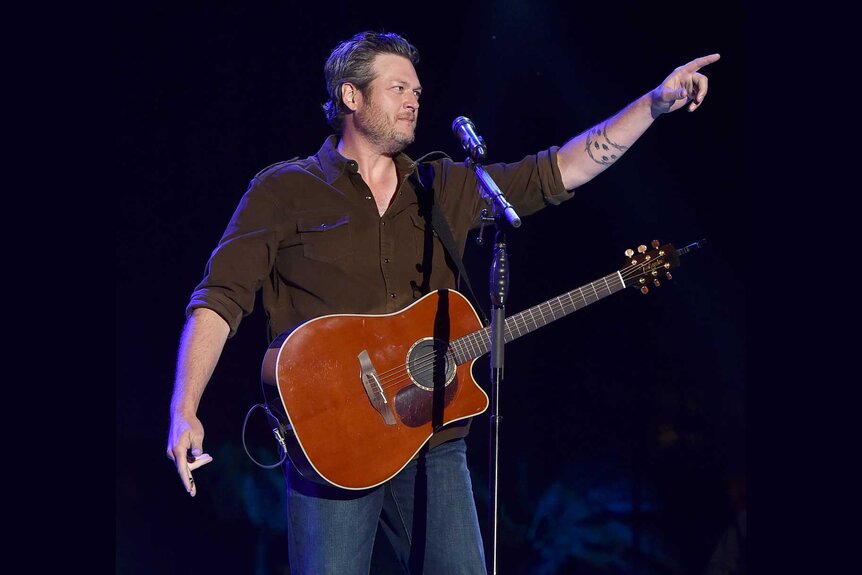 Blake Shelton performing on stage.