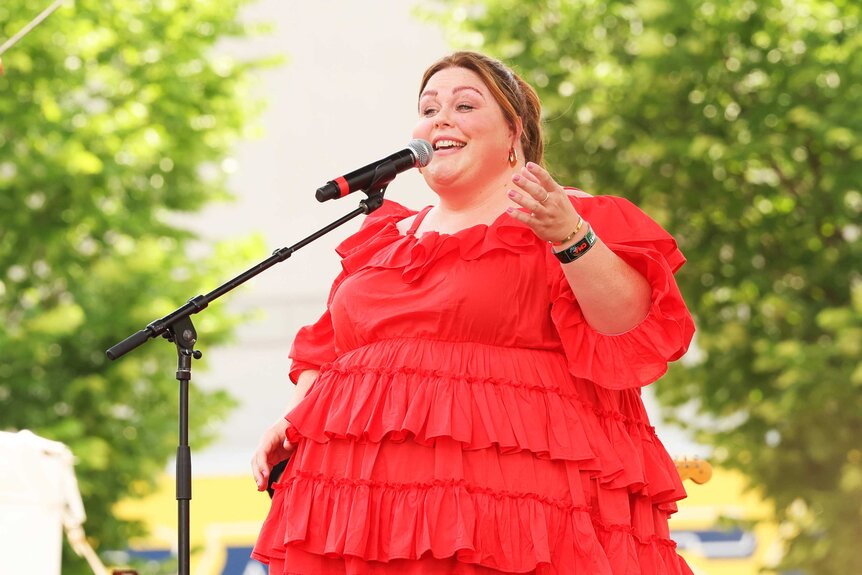 Chrissy Metz singing on stage.