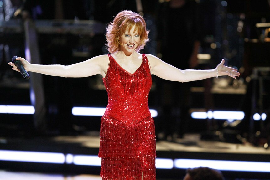 Reba McEntire performing on stage at the CMT Giants.