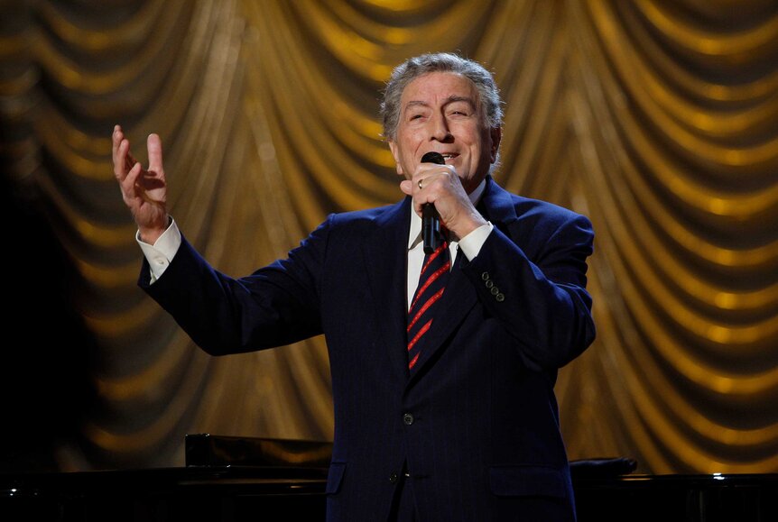 Tony Bennett singing on stage.