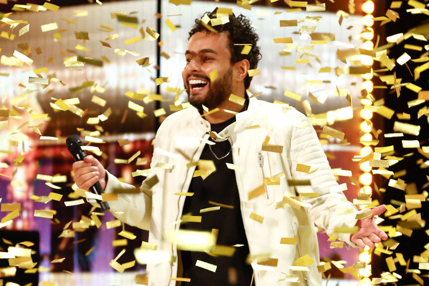 Gabriel Henrique receives the Golden Buzzer on the America's Got Talent stage