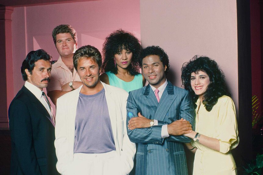 Lieutenant Martin Castillo, Detective Stan Switek, Detective James 'Sonny' Crockett, Detective Trudy Joplin, Detective Ricardo 'Rico' Tubbs, Detective Gina Navarro Calabrese appear in a promotional photo for Miami Vice.