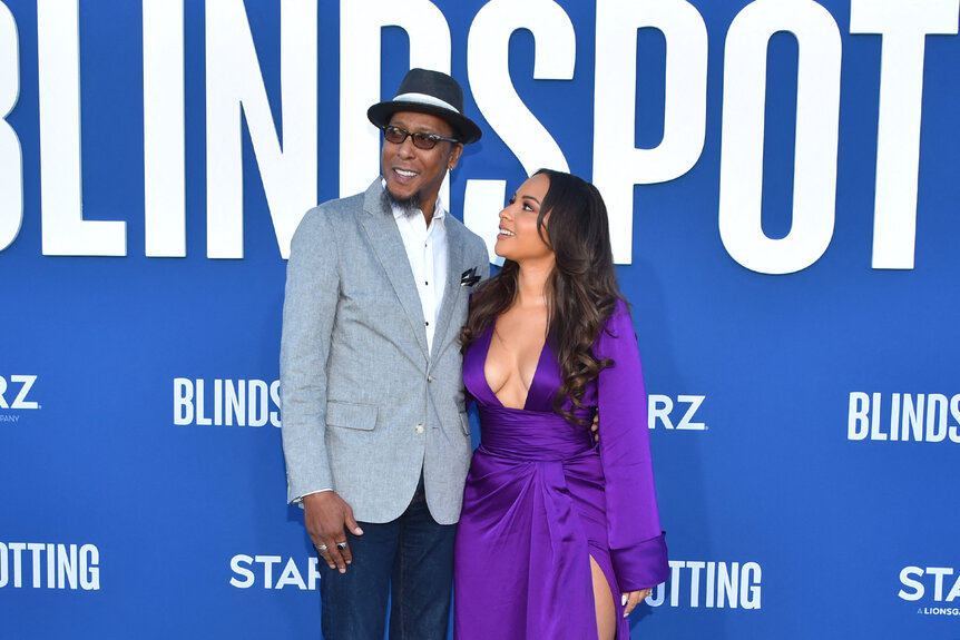 Ron Cephas Jones posing with Jasmine Jones at an event.