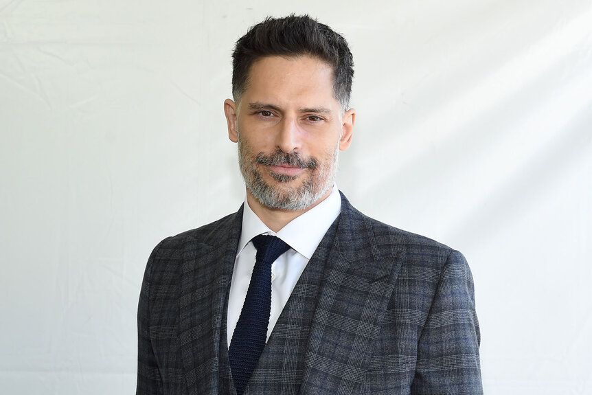 Joe Manganiello smiles wearing a plaid jacket at the 2022 Film Independent Spirit Awards